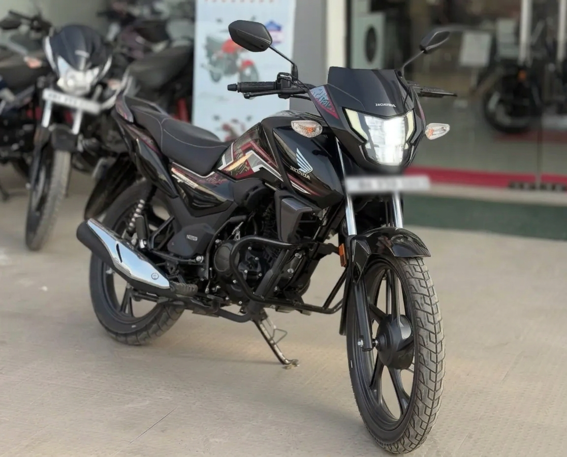 Honda SP 125 commuter motorcycle in India — 10.87 PS engine, 60-65 kmpl mileage and on-road price around ₹1,10,000